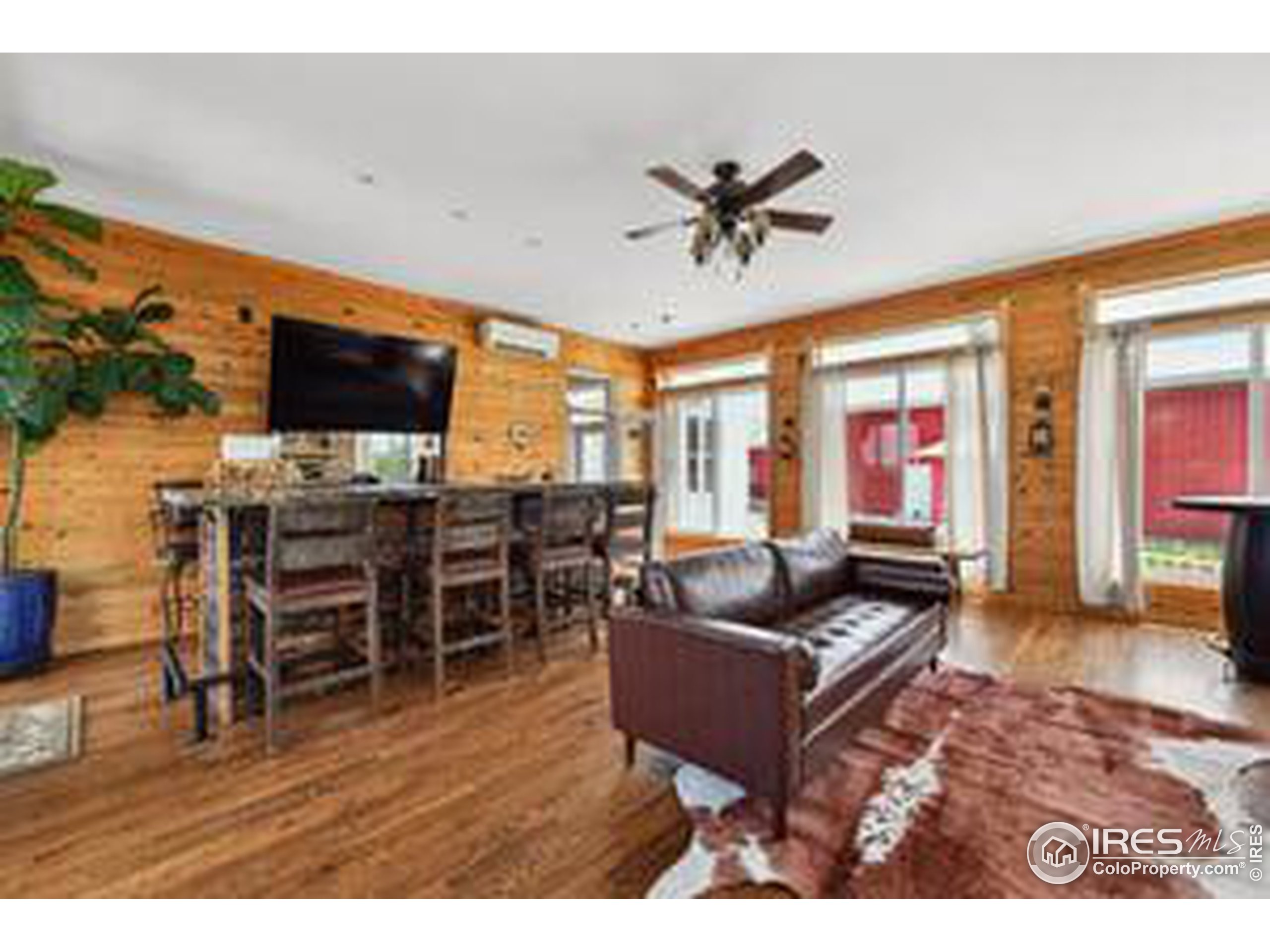 6261 County Road 41 Fort Lupton, CO 80621 - Photo 19 of 40 a living room with furniture and a flat screen tv