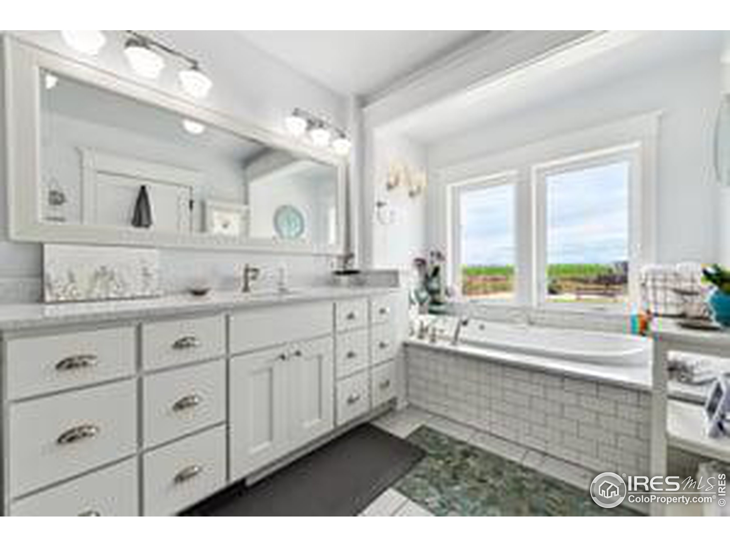 6261 County Road 41 Fort Lupton, CO 80621 - Photo 21 of 40 a bathroom with a granite countertop sink mirror and a