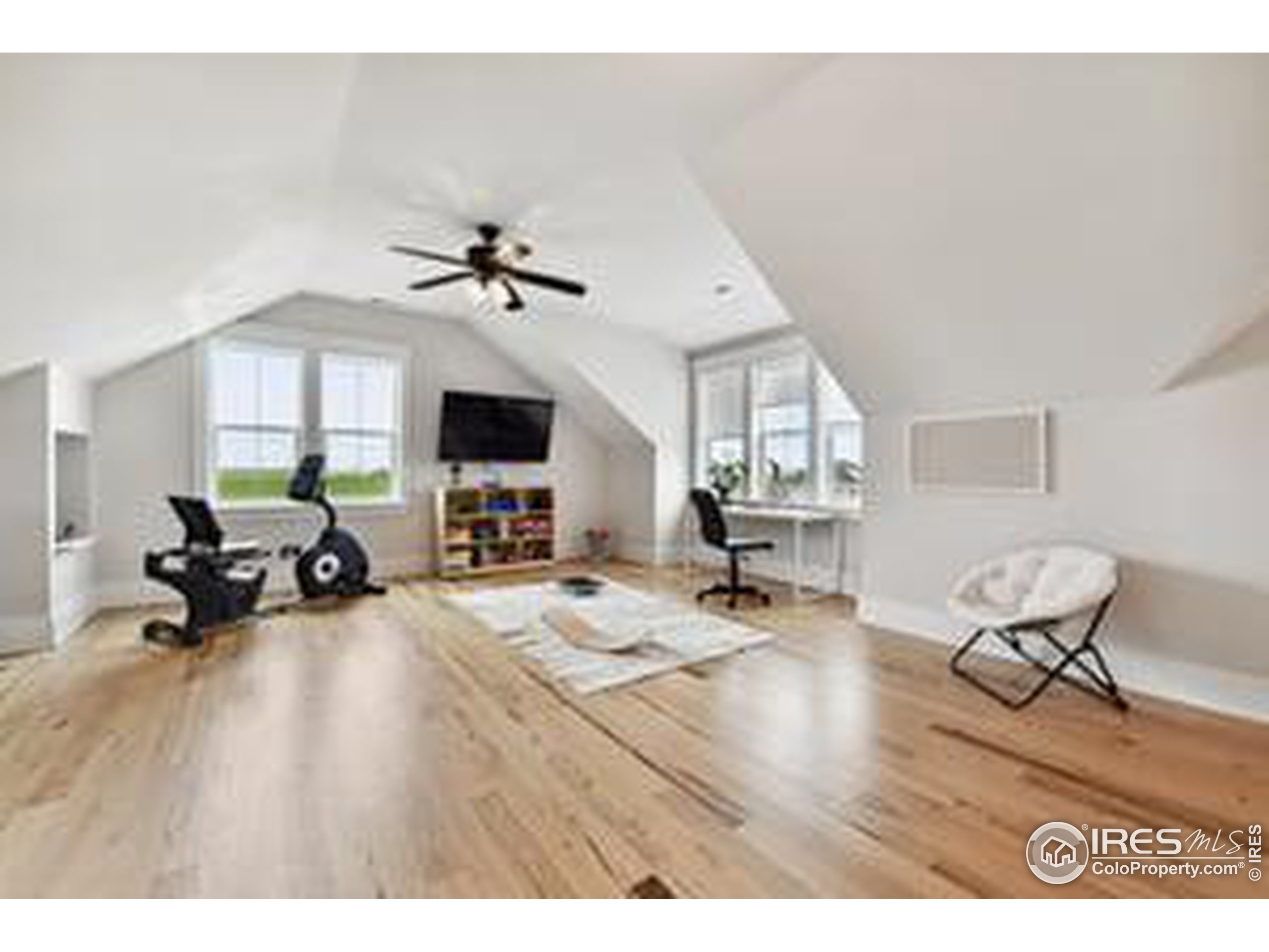 6261 County Road 41 Fort Lupton, CO 80621 - Photo 25 of 40 a living room with furniture and a flat screen tv