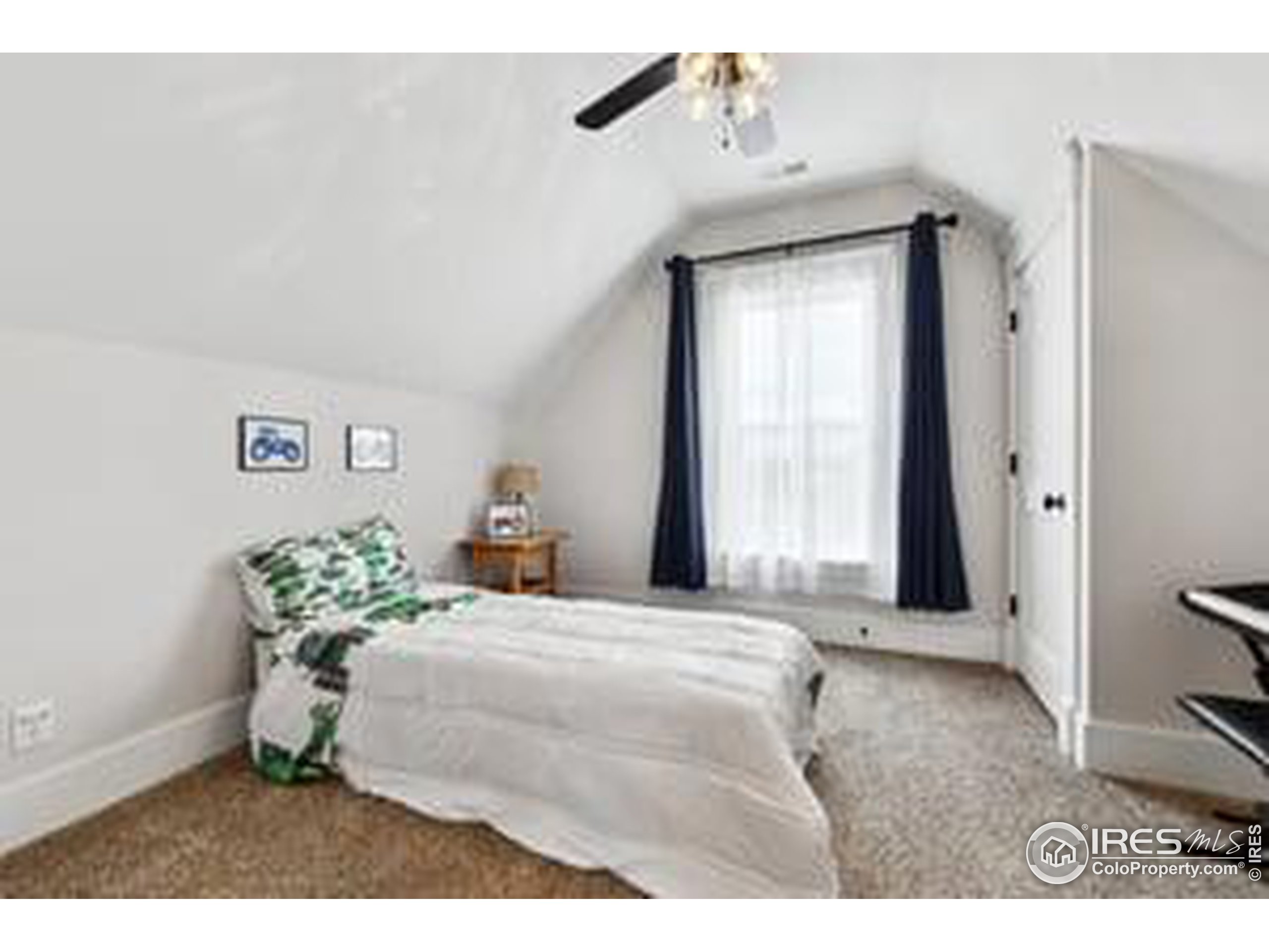 6261 County Road 41 Fort Lupton, CO 80621 - Photo 29 of 40 a bedroom with a bed and a window