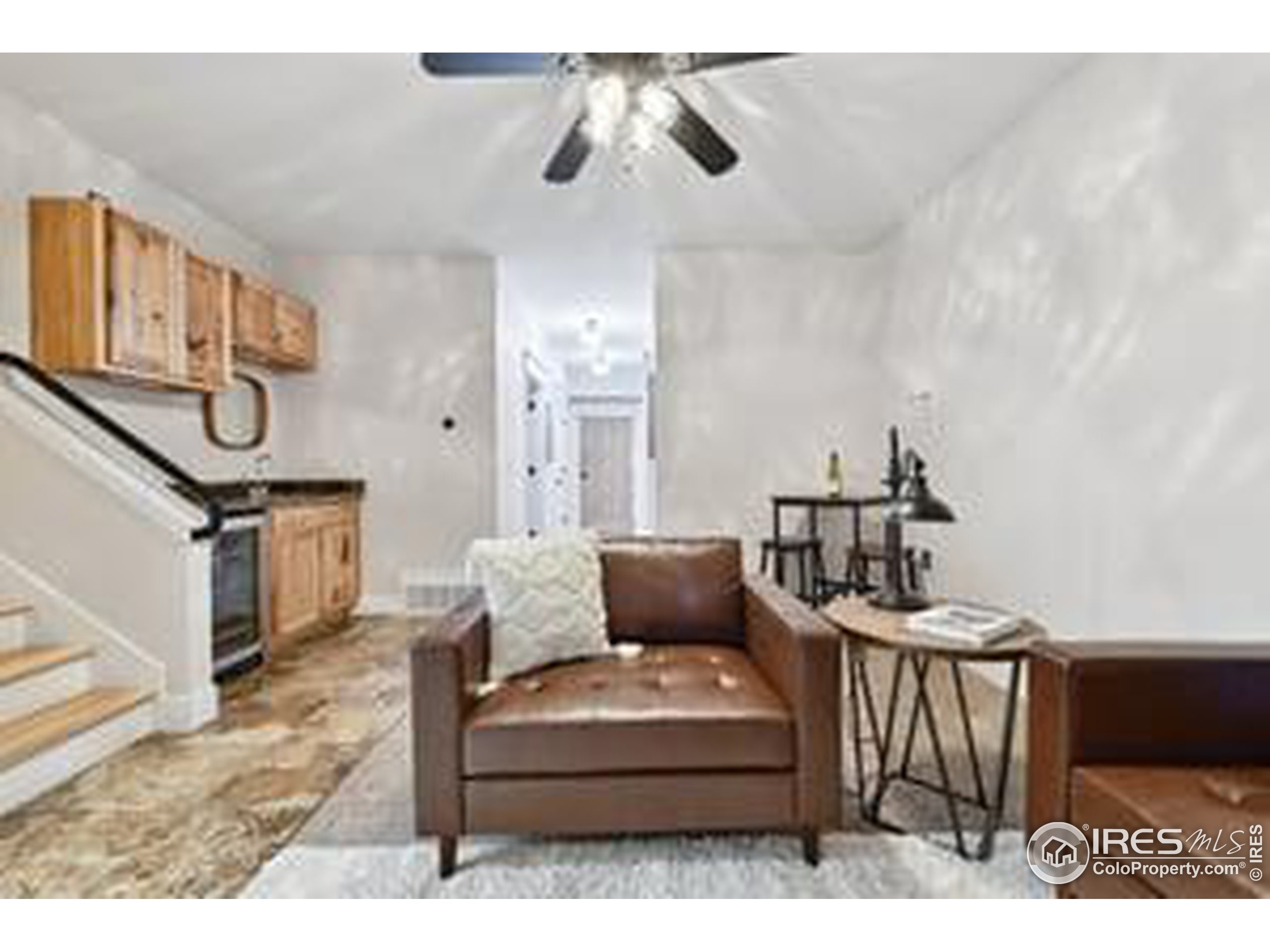 6261 County Road 41 Fort Lupton, CO 80621 - Photo 30 of 40 a living room with furniture and a chandelier