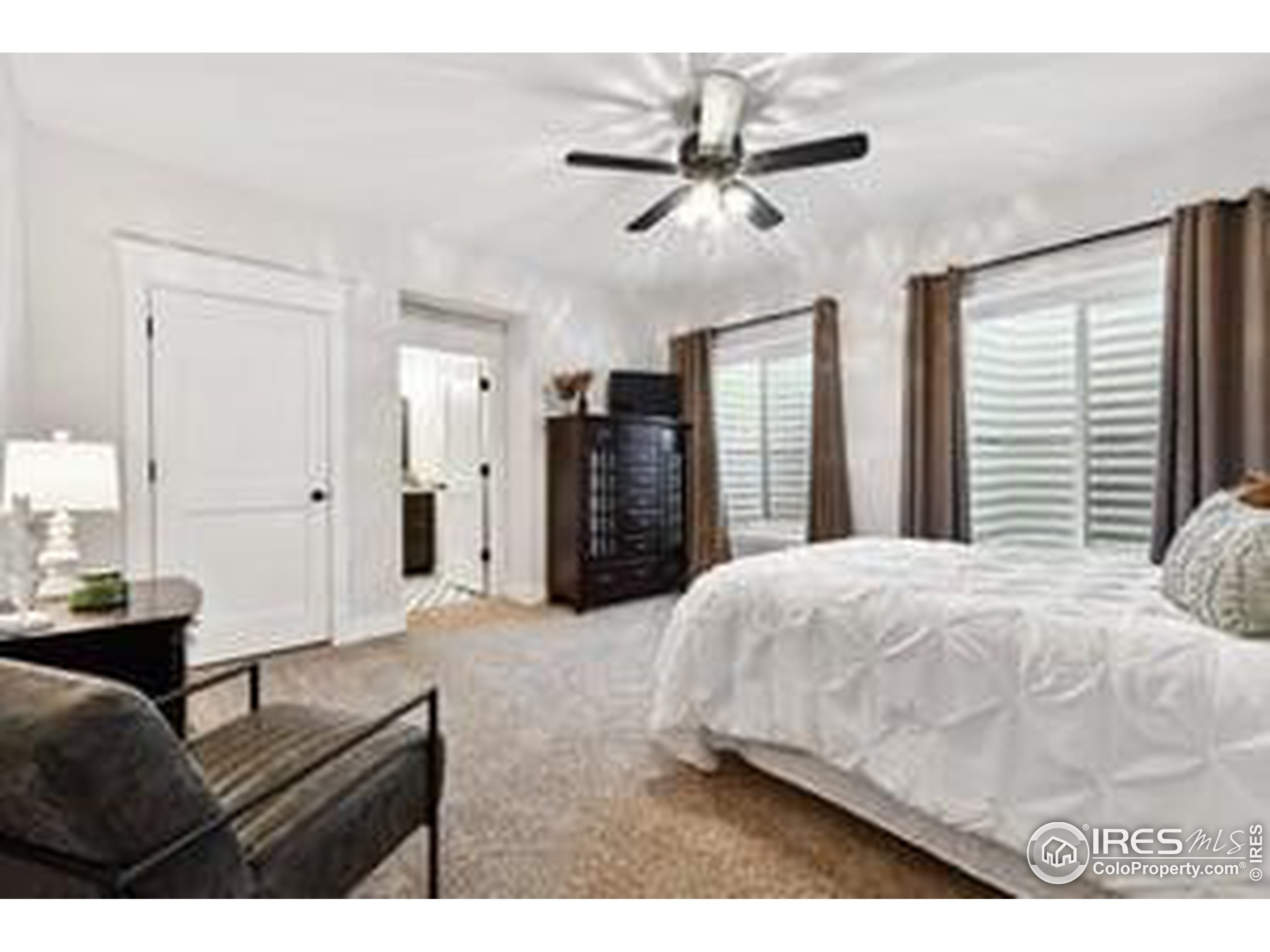 6261 County Road 41 Fort Lupton, CO 80621 - Photo 31 of 40 a living room with a bed furniture and a large window
