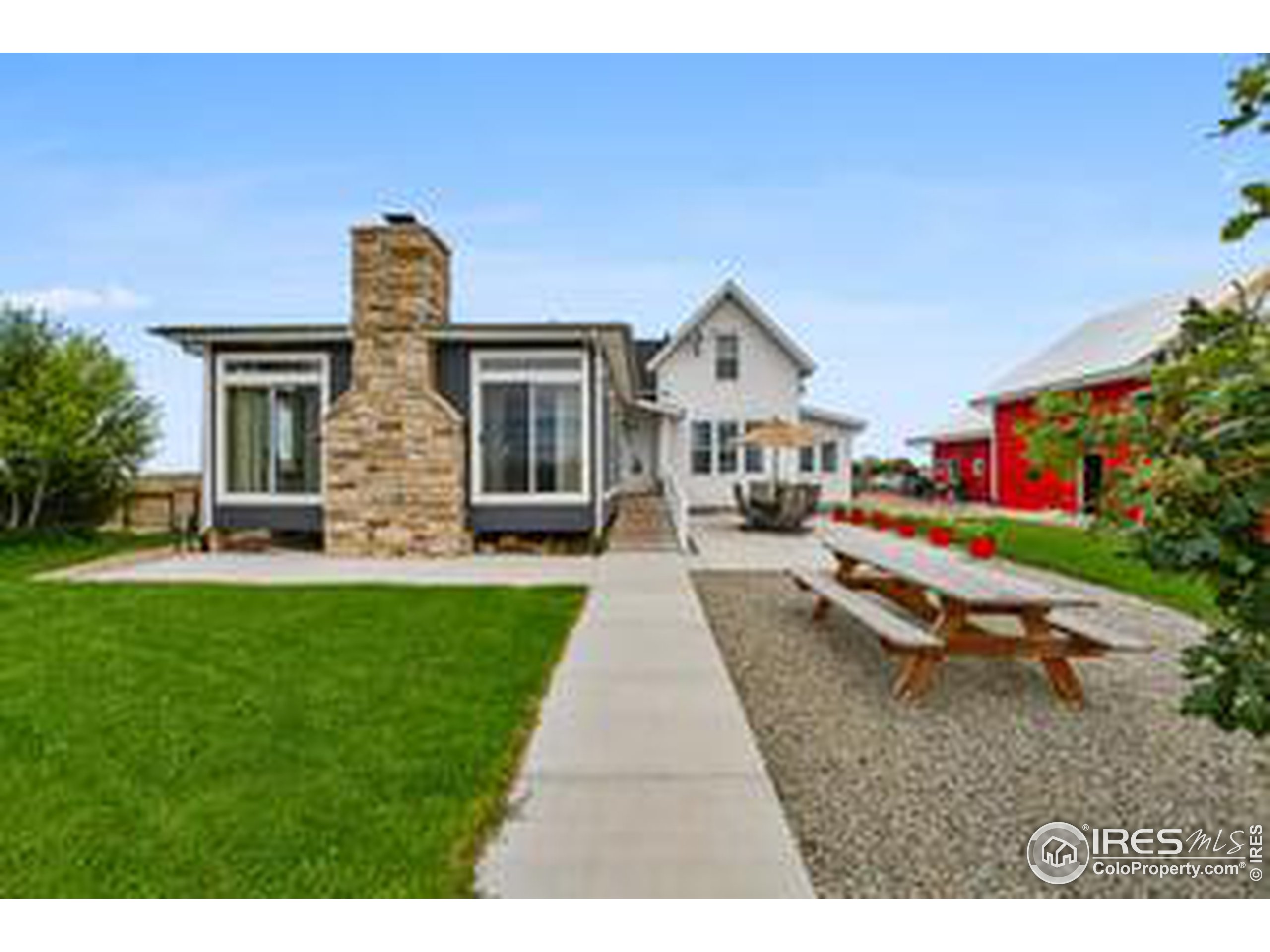6261 County Road 41 Fort Lupton, CO 80621 - Photo 38 of 40 a front view of a house with a yard