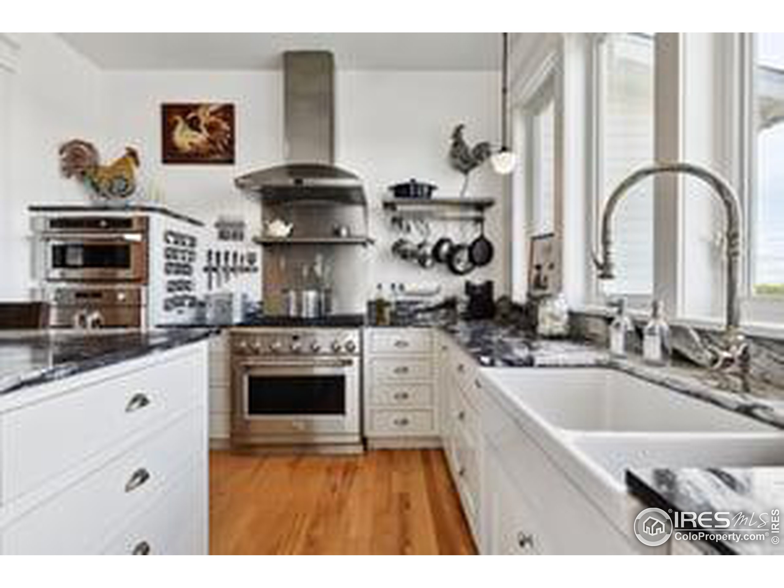 6261 County Road 41 Fort Lupton, CO 80621 - Photo 10 of 40 a kitchen with stainless steel appliances granite countertop a sink stove and refrigerator