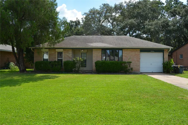 a view of a house with garden and yard