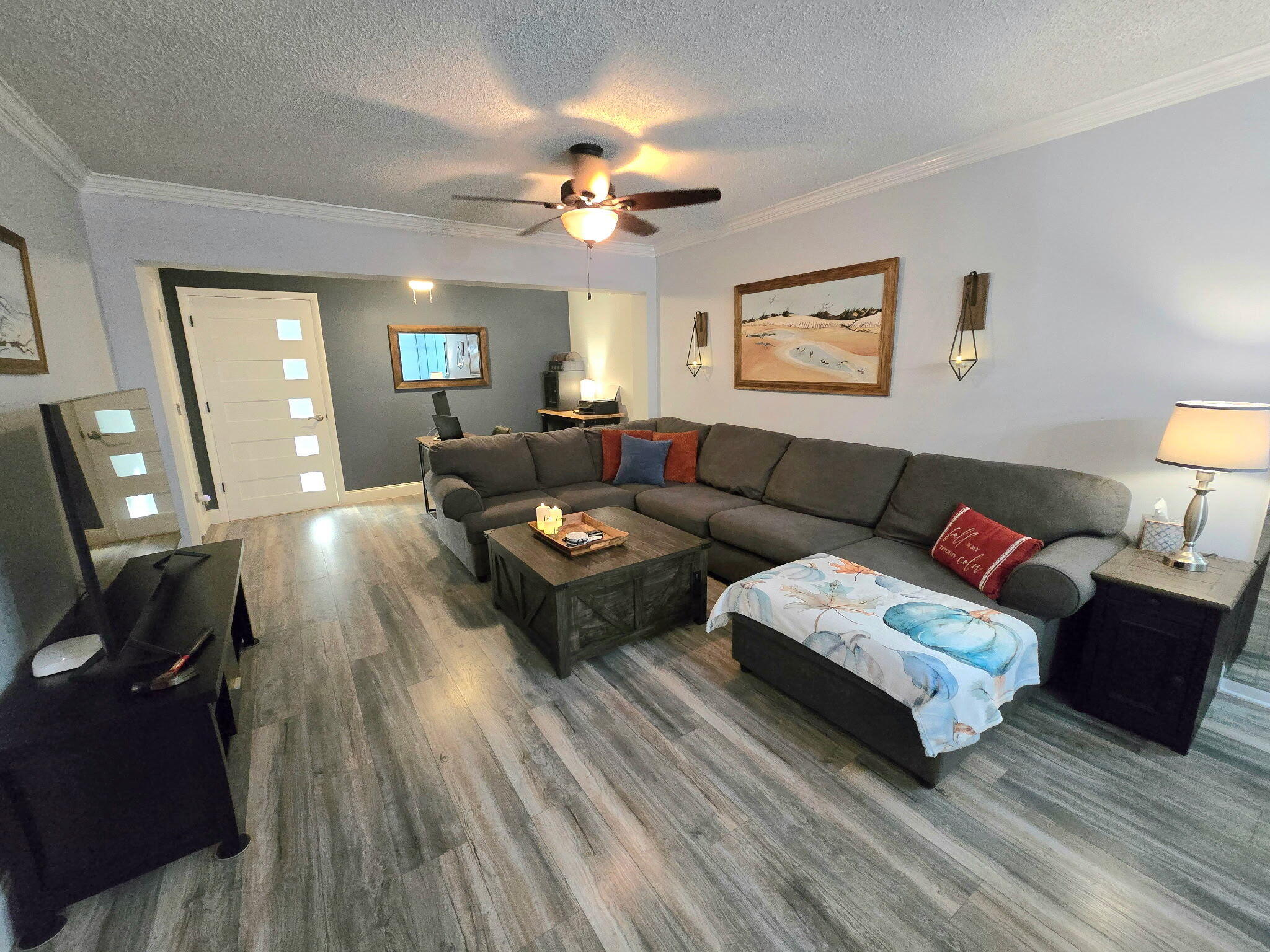 2720 Southwest 15th Street, Unit 2C Delray Beach, FL 33445 - Photo 14 of 31 a living room with furniture and a wooden floor