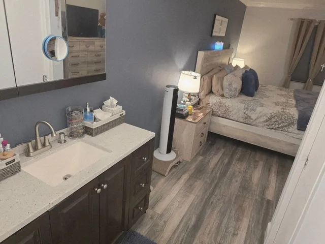 a white toilet sitting next to a bathroom sink