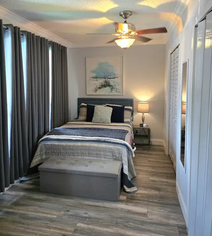 a bedroom with a bed and a television