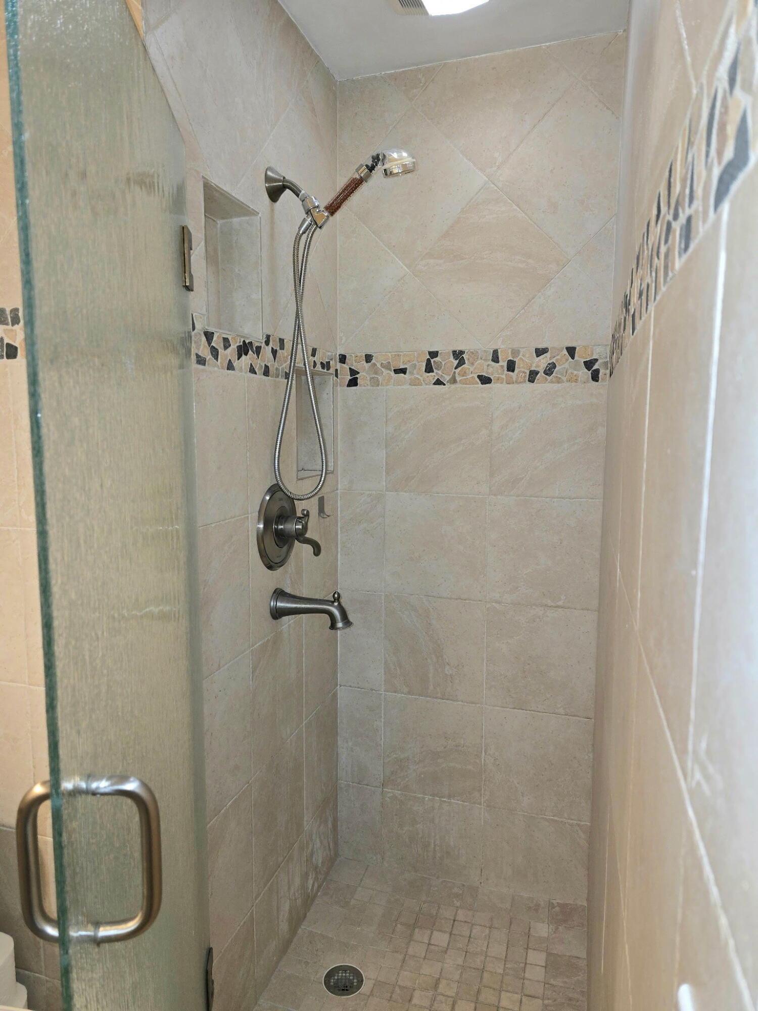 2720 Southwest 15th Street, Unit 2C Delray Beach, FL 33445 - Photo 23 of 31 a bathroom with a shower
