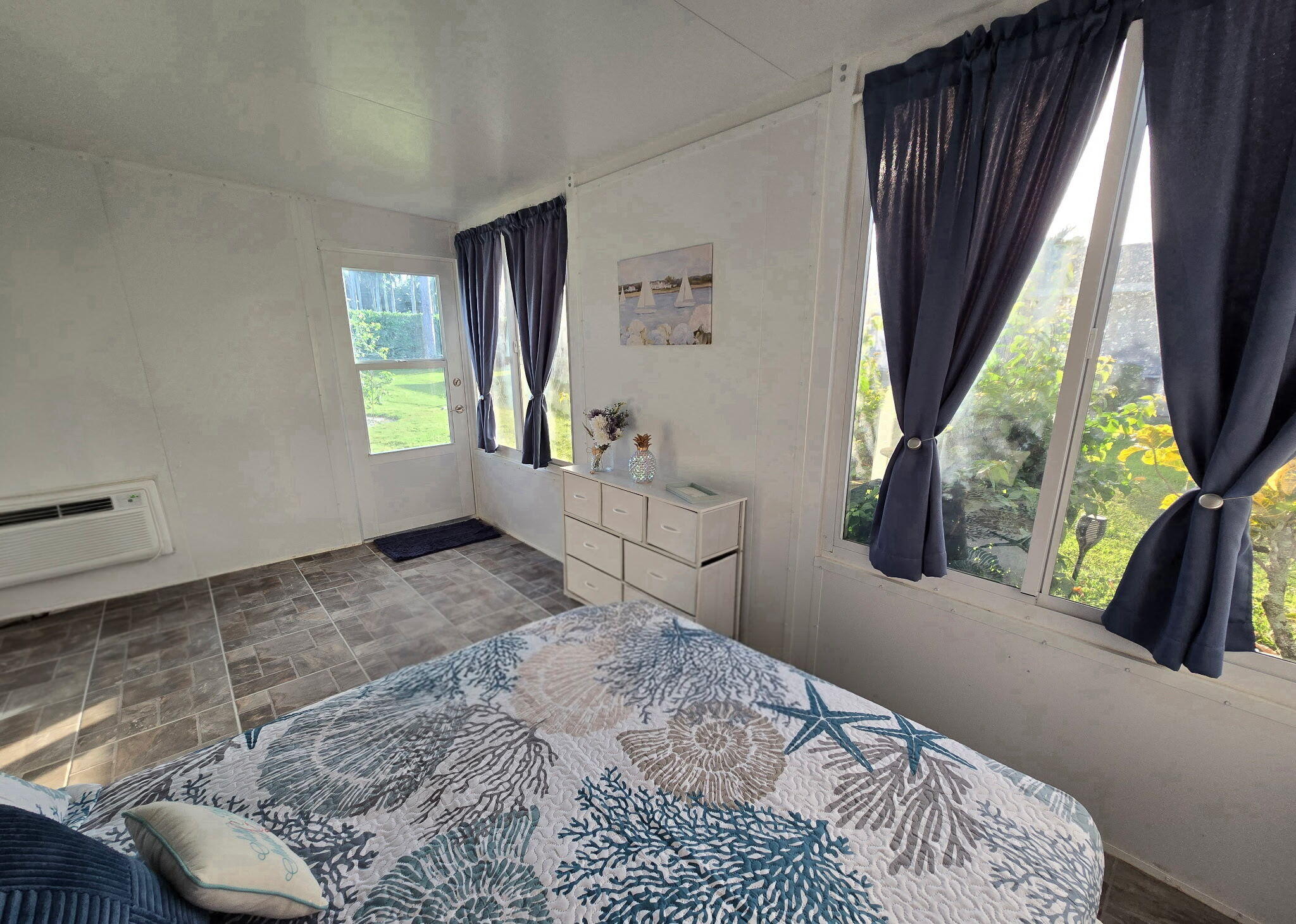 2720 Southwest 15th Street, Unit 2C Delray Beach, FL 33445 - Photo 26 of 31 a bedroom with a bed and a large window