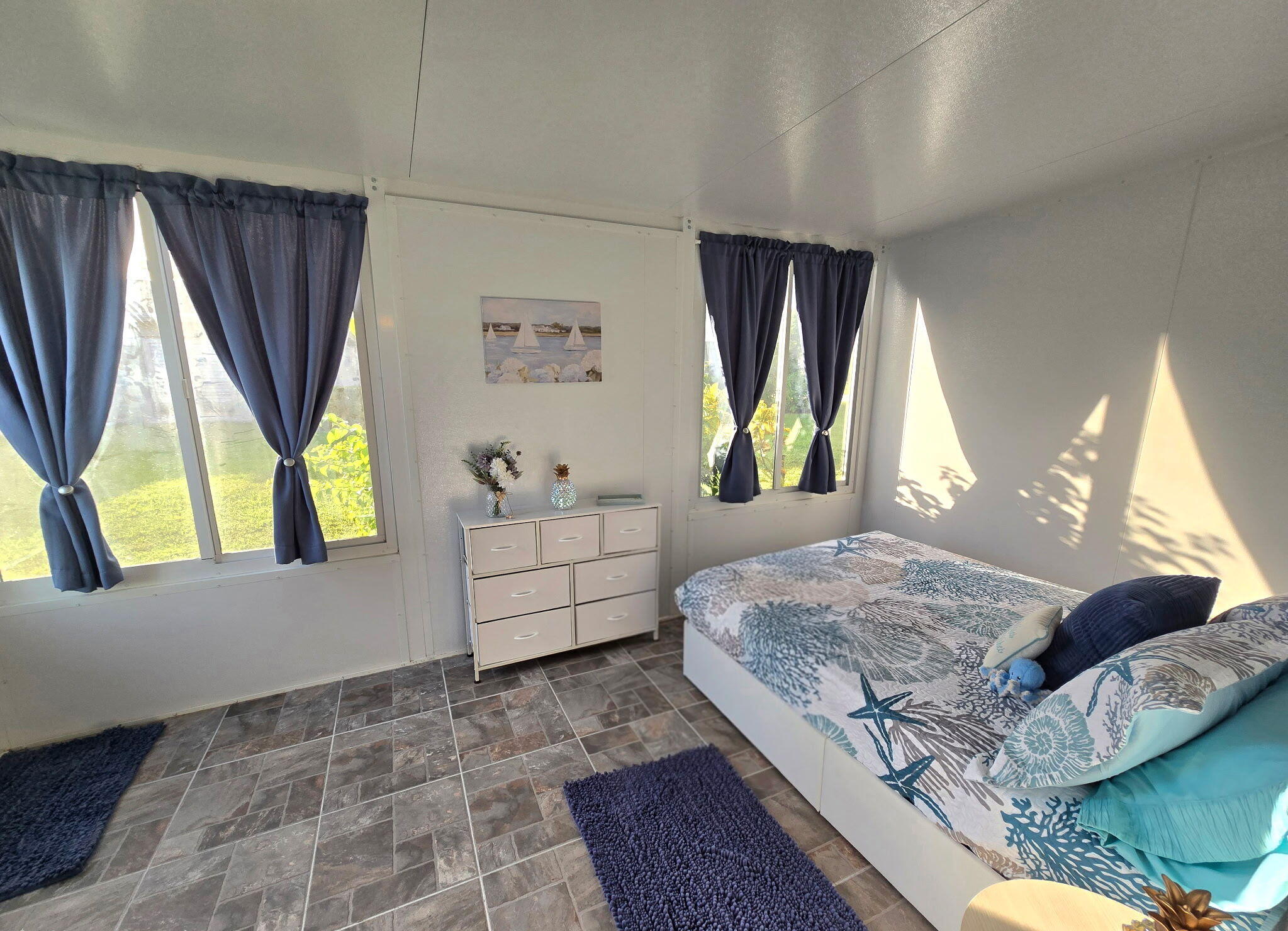 2720 Southwest 15th Street, Unit 2C Delray Beach, FL 33445 - Photo 27 of 31 a bedroom with a bed and a window