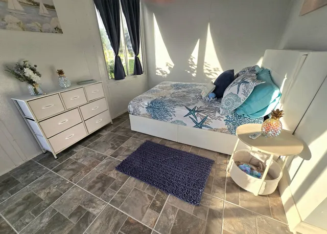 a view of a livingroom with furniture and wooden floor