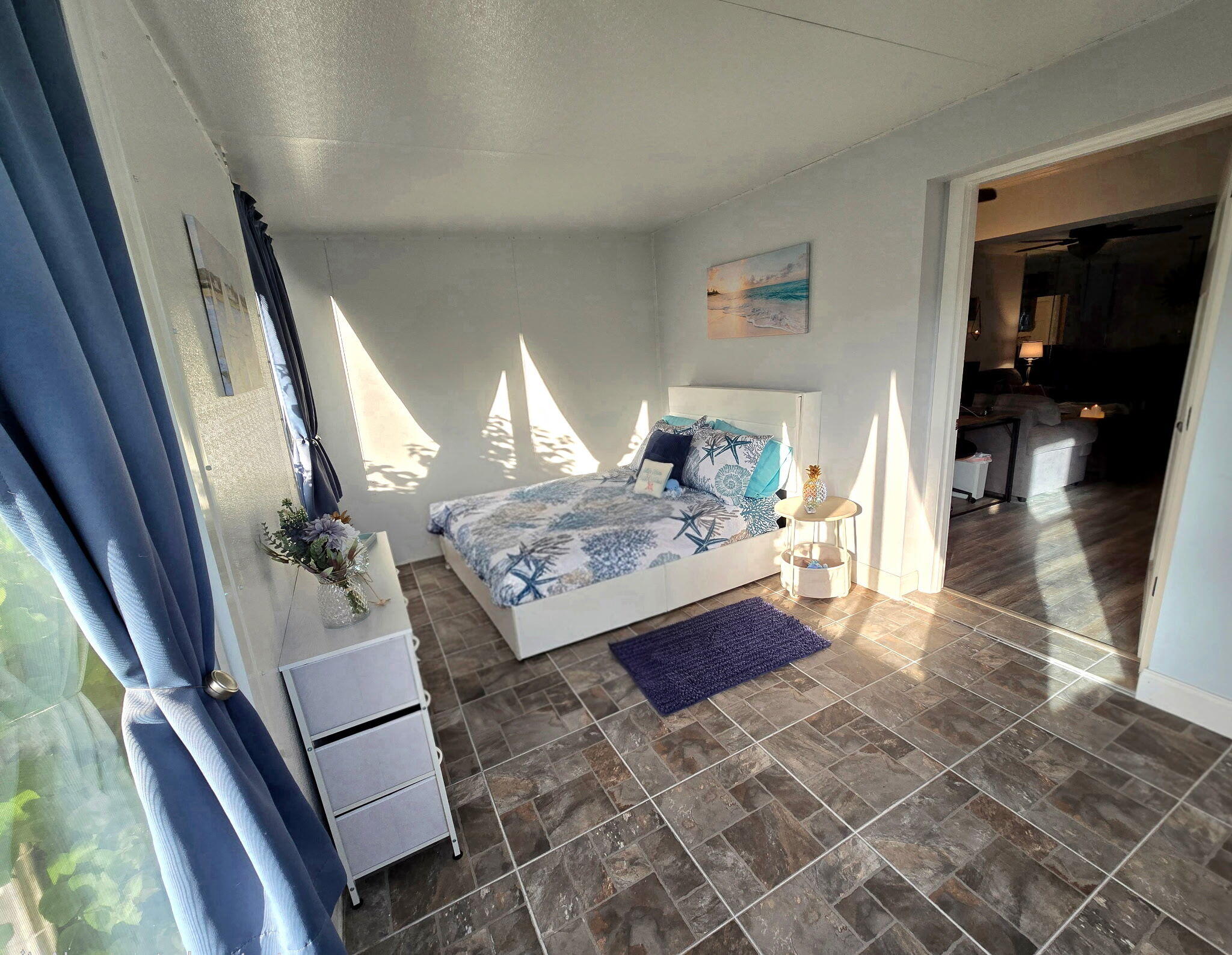 2720 Southwest 15th Street, Unit 2C Delray Beach, FL 33445 - Photo 29 of 31 a living room with furniture and a rug