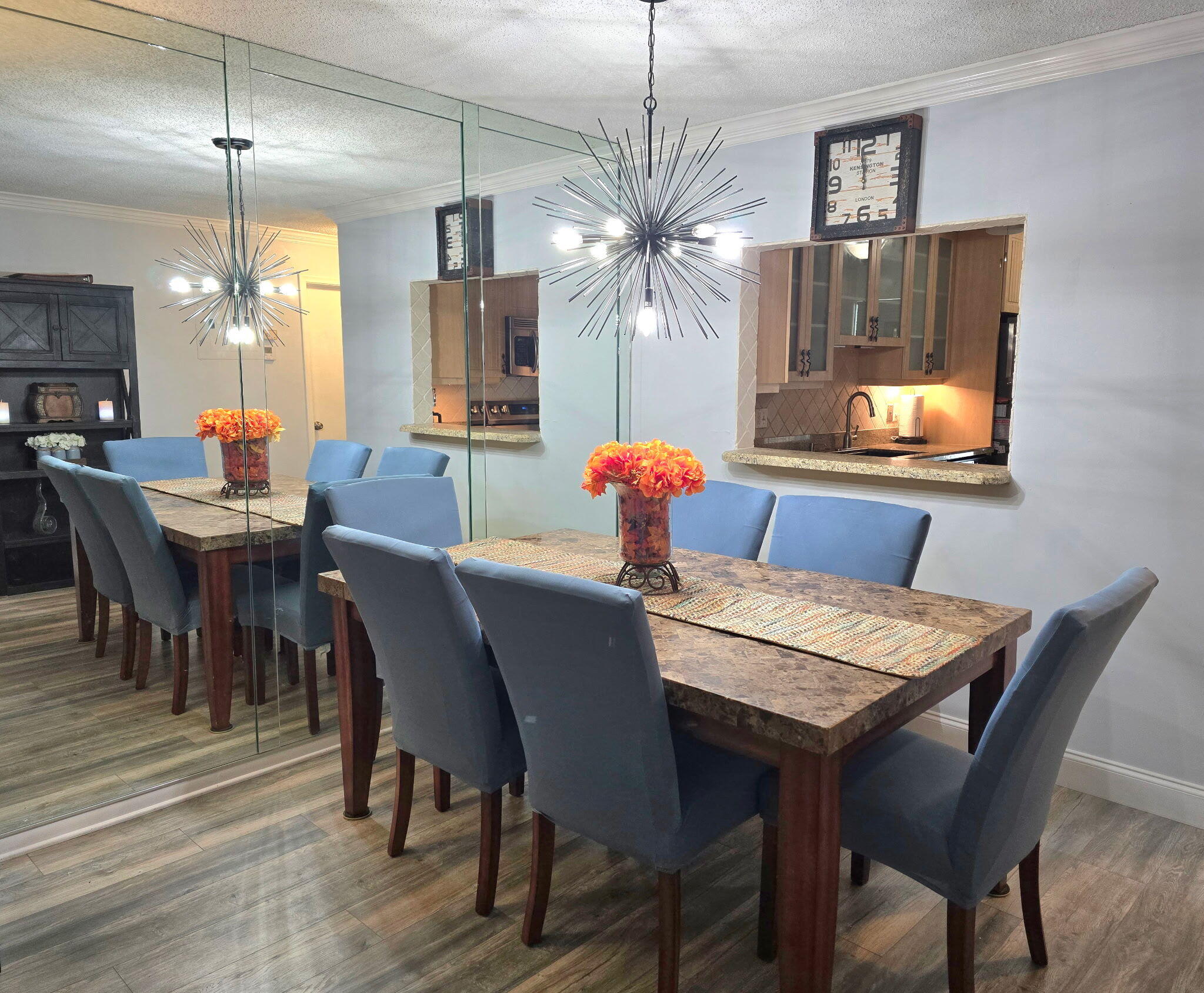 2720 Southwest 15th Street, Unit 2C Delray Beach, FL 33445 - Photo 7 of 31 a dining room with furniture a chandelier and window