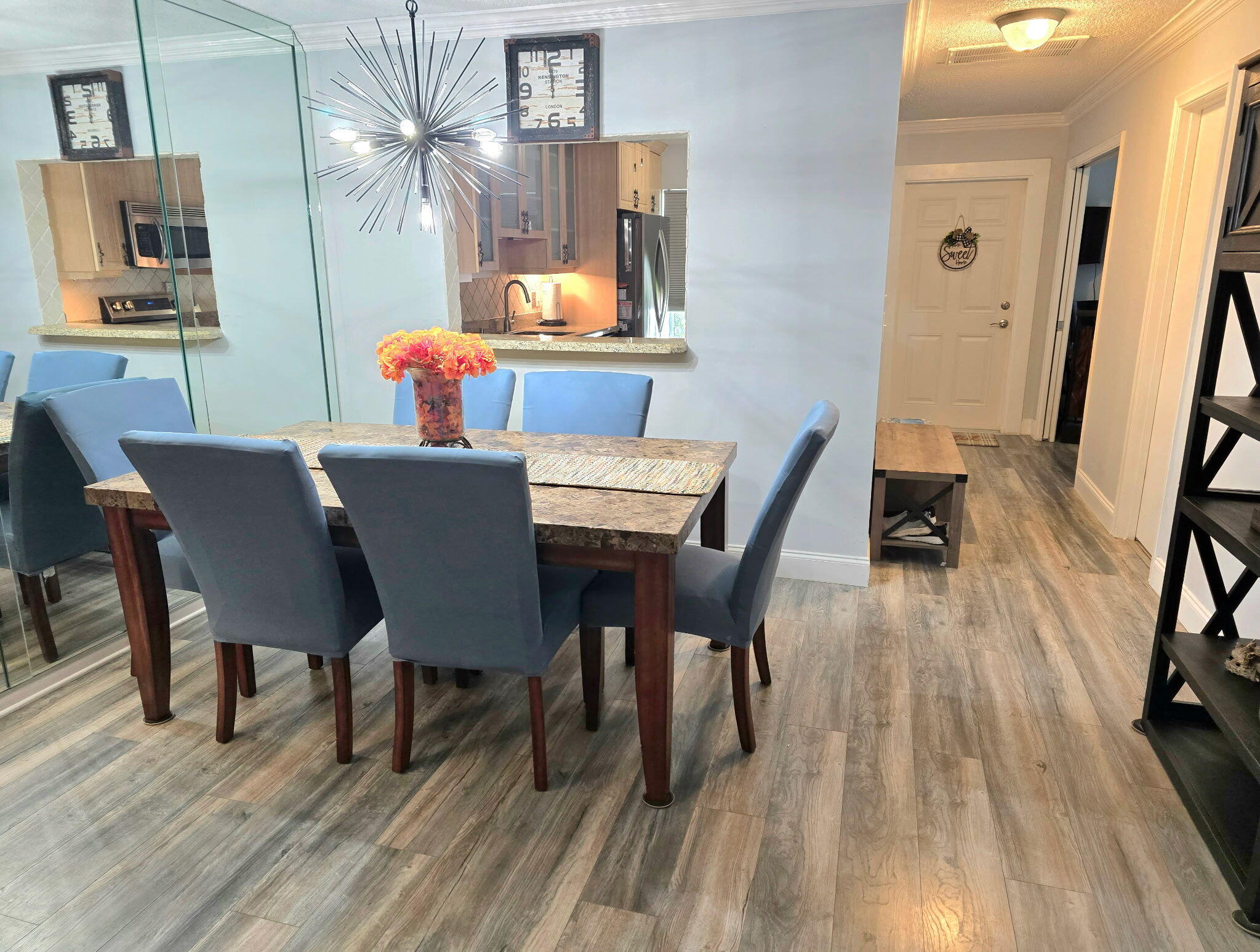 2720 Southwest 15th Street, Unit 2C Delray Beach, FL 33445 - Photo 8 of 31 a dining room with furniture and wooden floor