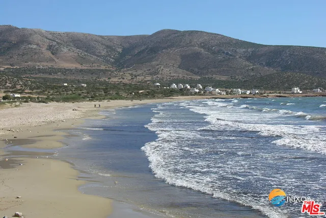 a view of a road with an ocean beach