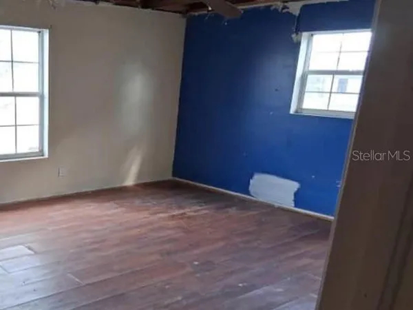 a view of a room with windows