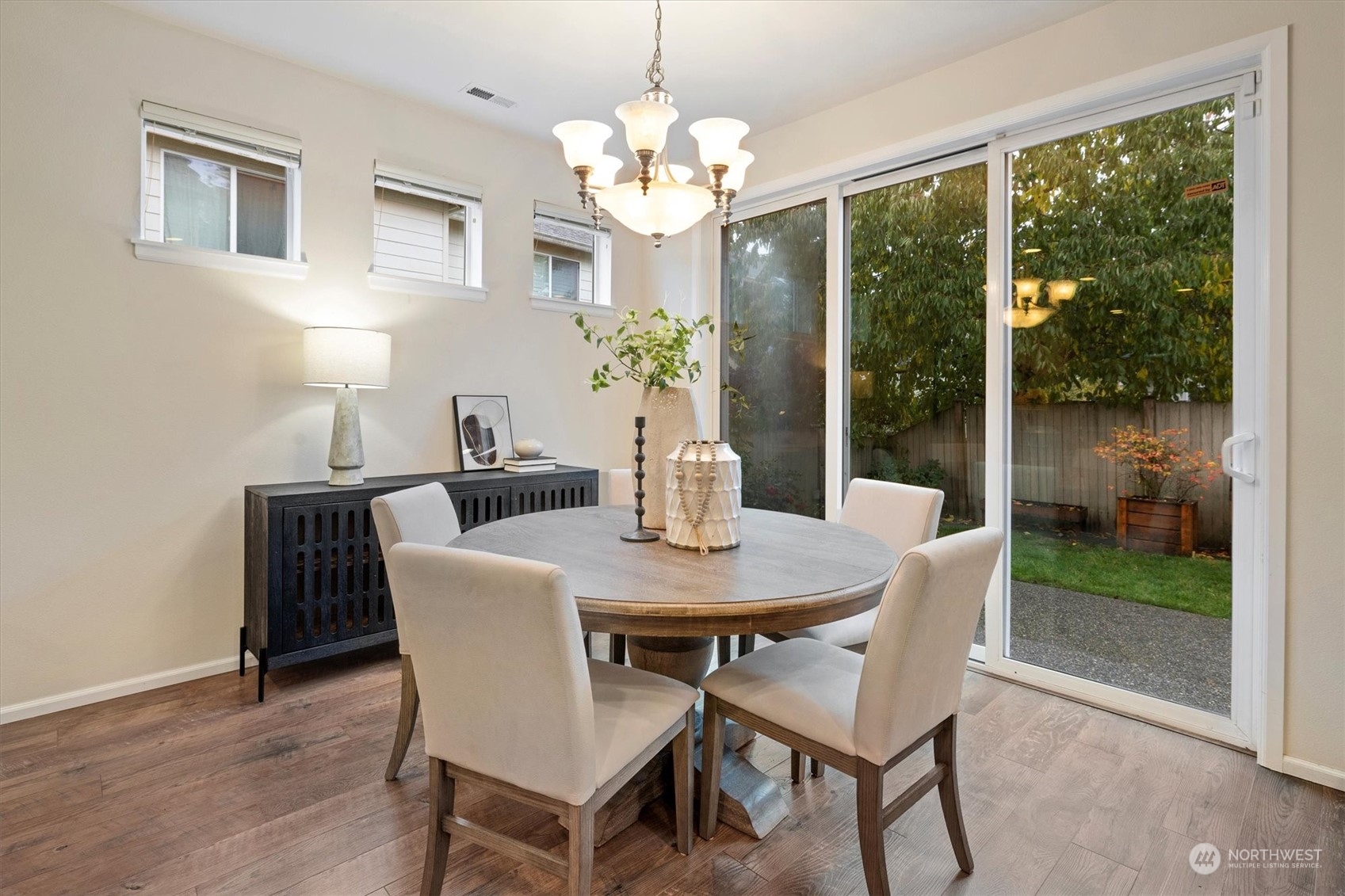 16023 35th Park Southeast Bothell, WA 98012 - Photo 15 of 34 a view of a dining room with furniture a chandelier and wooden floor