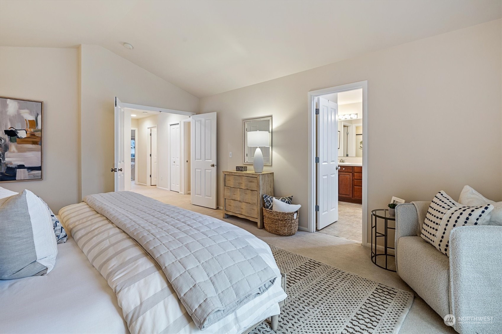 16023 35th Park Southeast Bothell, WA 98012 - Photo 17 of 34 a spacious bedroom with a bed and glass walk in closet