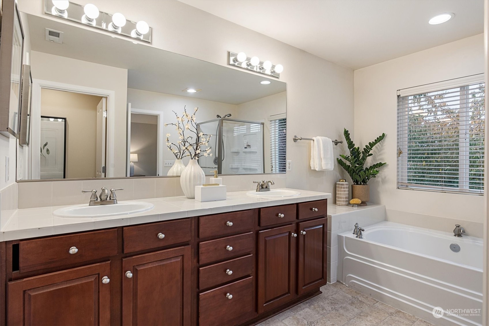 16023 35th Park Southeast Bothell, WA 98012 - Photo 18 of 34 a spacious bathroom with a granite countertop sink mirror and a bathtub