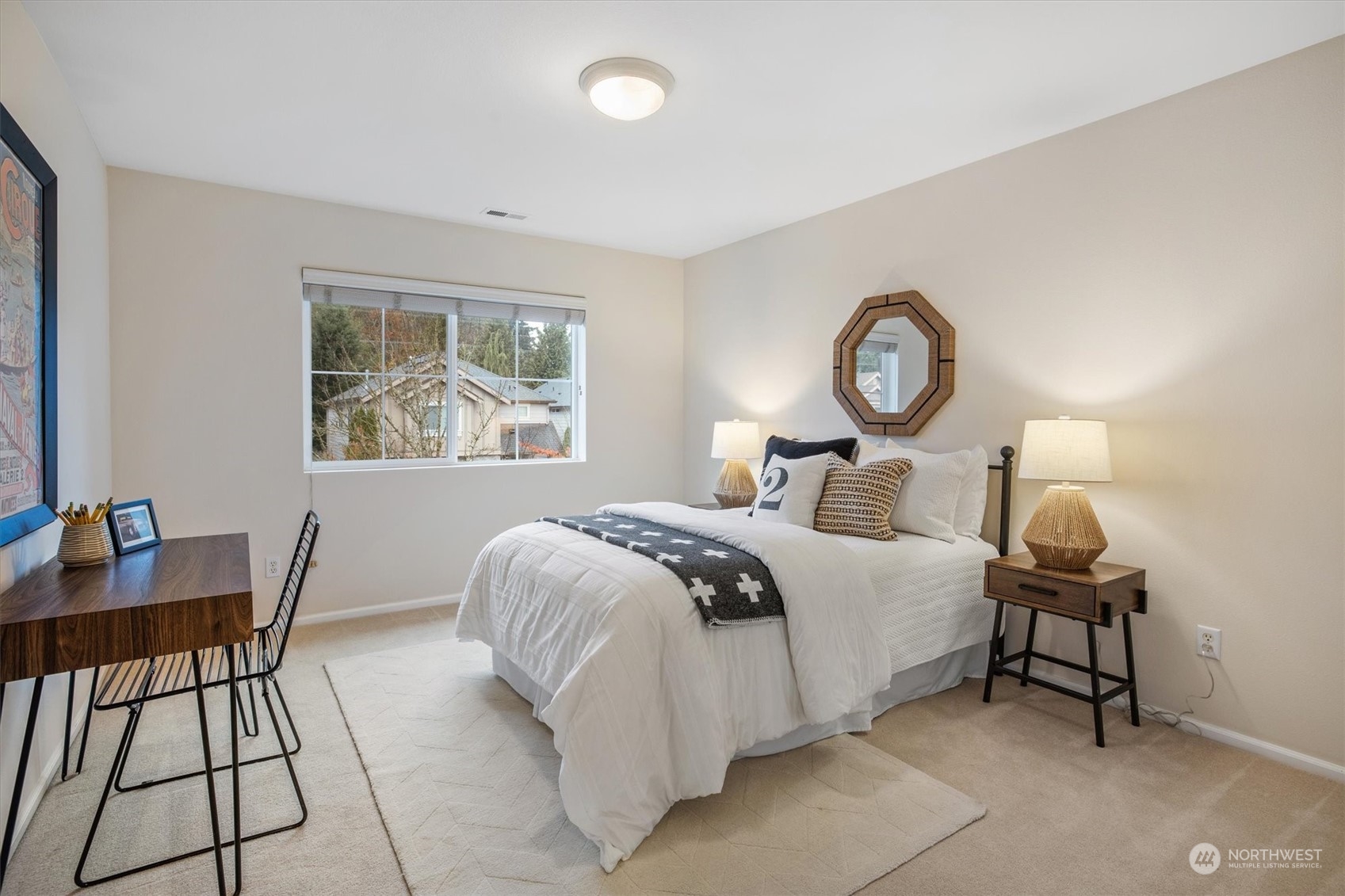 16023 35th Park Southeast Bothell, WA 98012 - Photo 21 of 34 a bedroom with a bed and a table in it next to a window