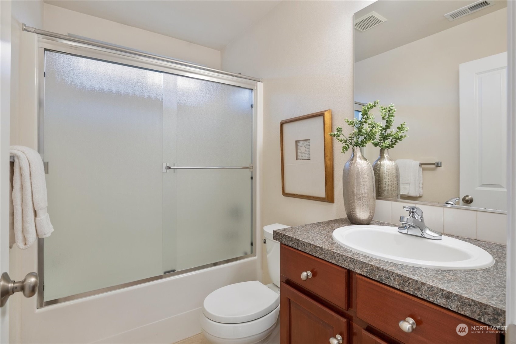 16023 35th Park Southeast Bothell, WA 98012 - Photo 22 of 34 a bathroom with a granite countertop sink toilet and shower