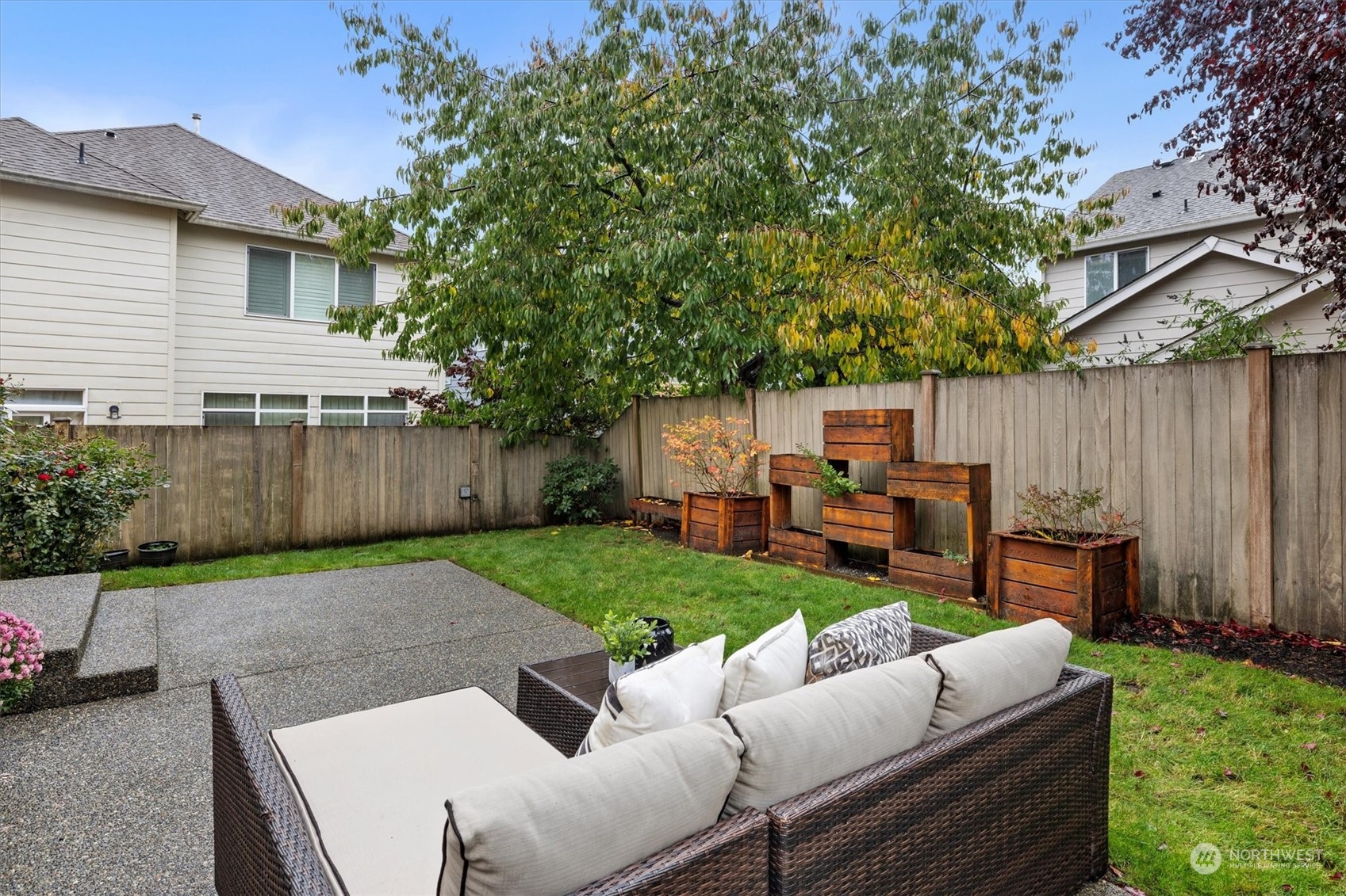 16023 35th Park Southeast Bothell, WA 98012 - Photo 27 of 34 a view of a backyard with couches plants and large tree