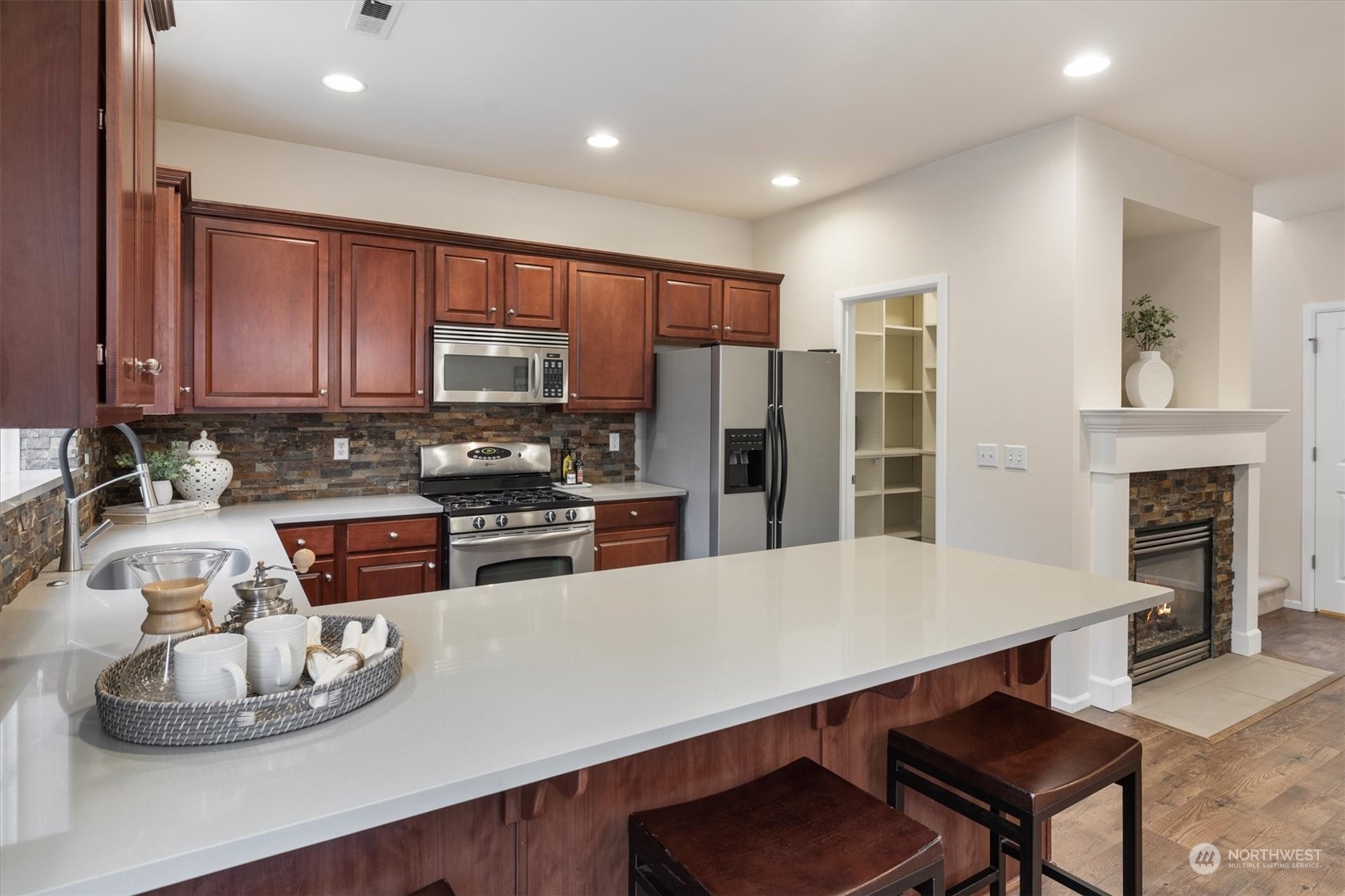 16023 35th Park Southeast Bothell, WA 98012 - Photo 10 of 34 a kitchen with stainless steel appliances a dining table and chairs