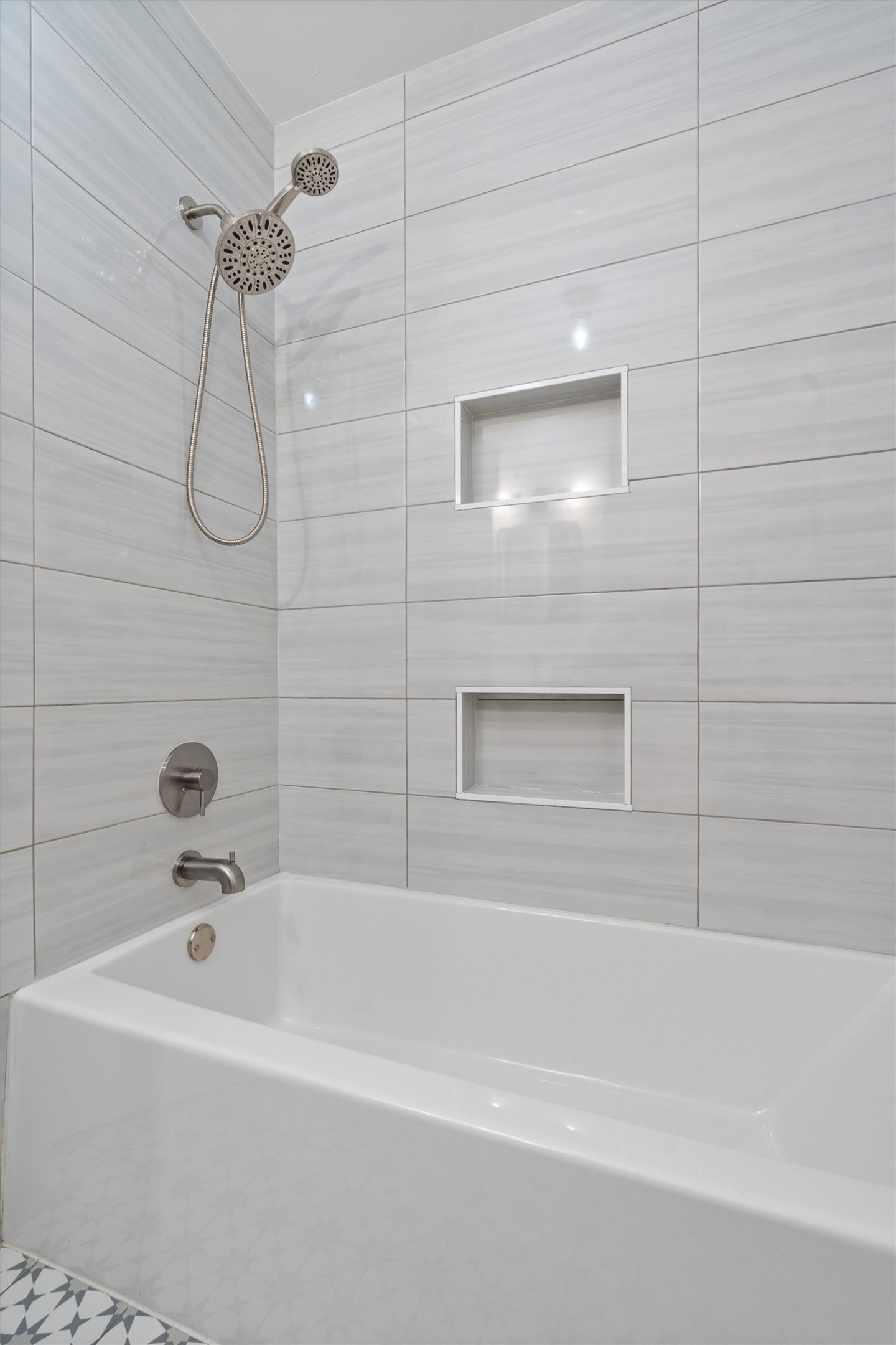 8436 Bangor Bend Austin, TX 78758 - Photo 21 of 29 The shower/tub combo has built-in niches, and a clean setup.