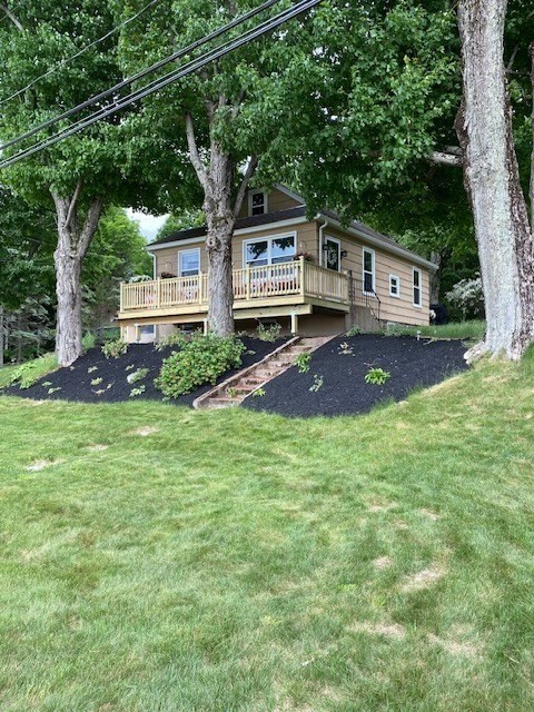 front view of a house with a big yard