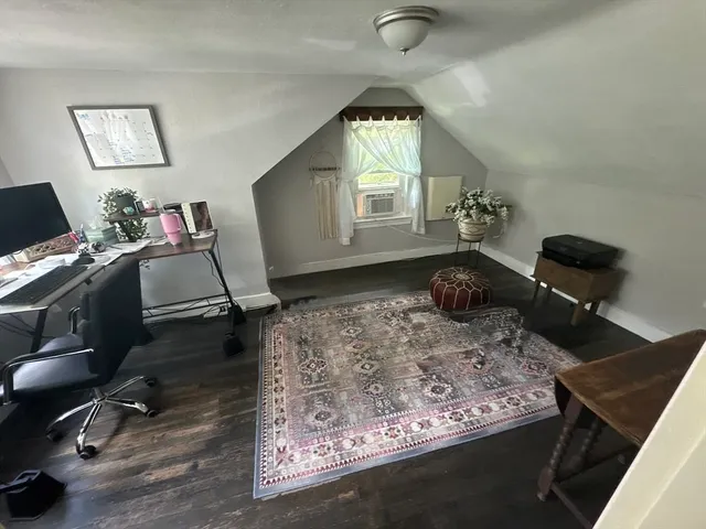 a workspace with furniture and window