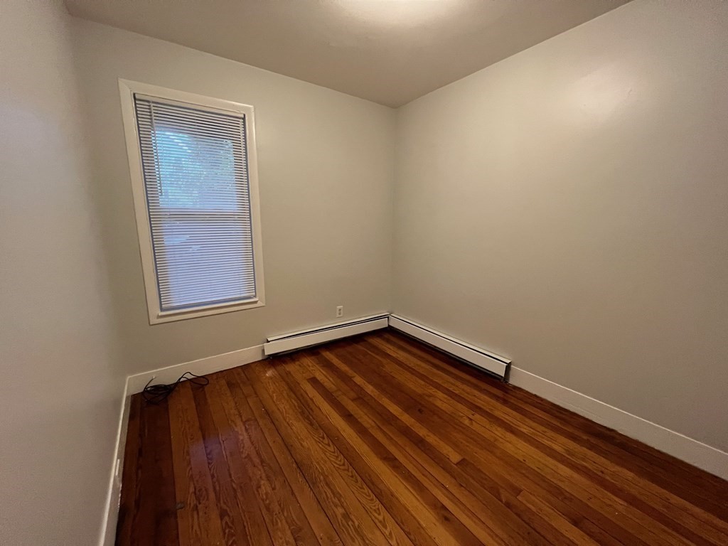 3 Carson Street, Unit 1 Boston, MA 02125 - Photo 2 of 14 a view of an empty room and window