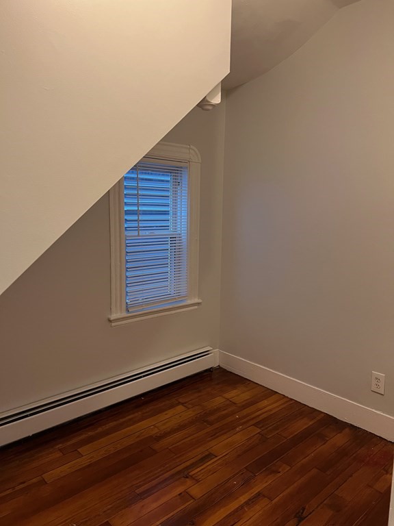 3 Carson Street, Unit 1 Boston, MA 02125 - Photo 5 of 14 a view of an empty room with wooden floor and a window