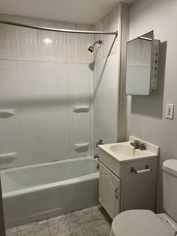 3 Carson Street, Unit 1 Boston, MA 02125 - Photo 7 of 14 a bathroom with a sink a toilet and shower
