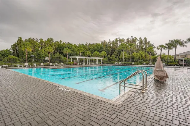 a view of a swimming pool with an outdoor seating