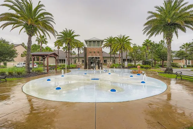 a view of a porch with a floor to ceiling window and a yard