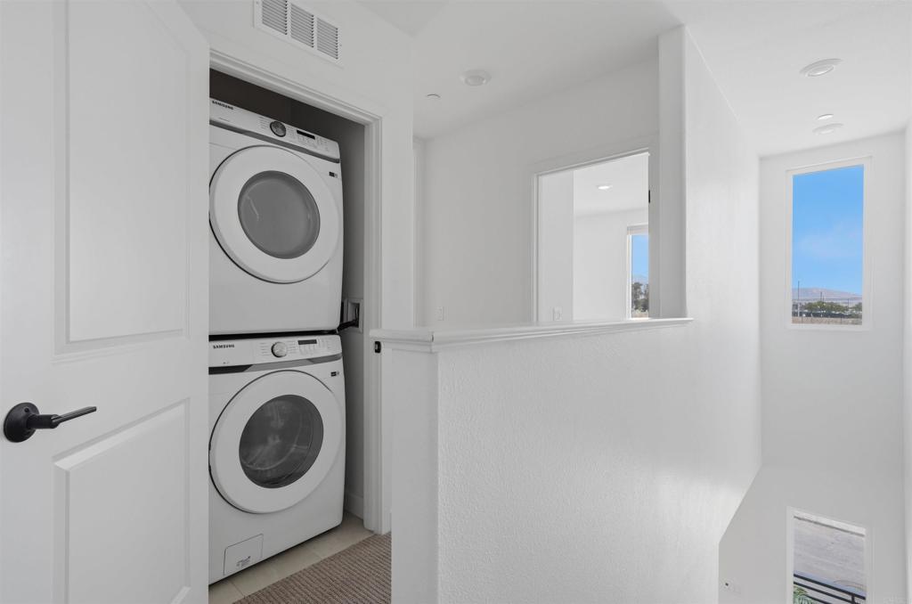 2402 Cascalote Loop San Diego, CA 92154 - Photo 30 of 35 a utility room with dryer and washer