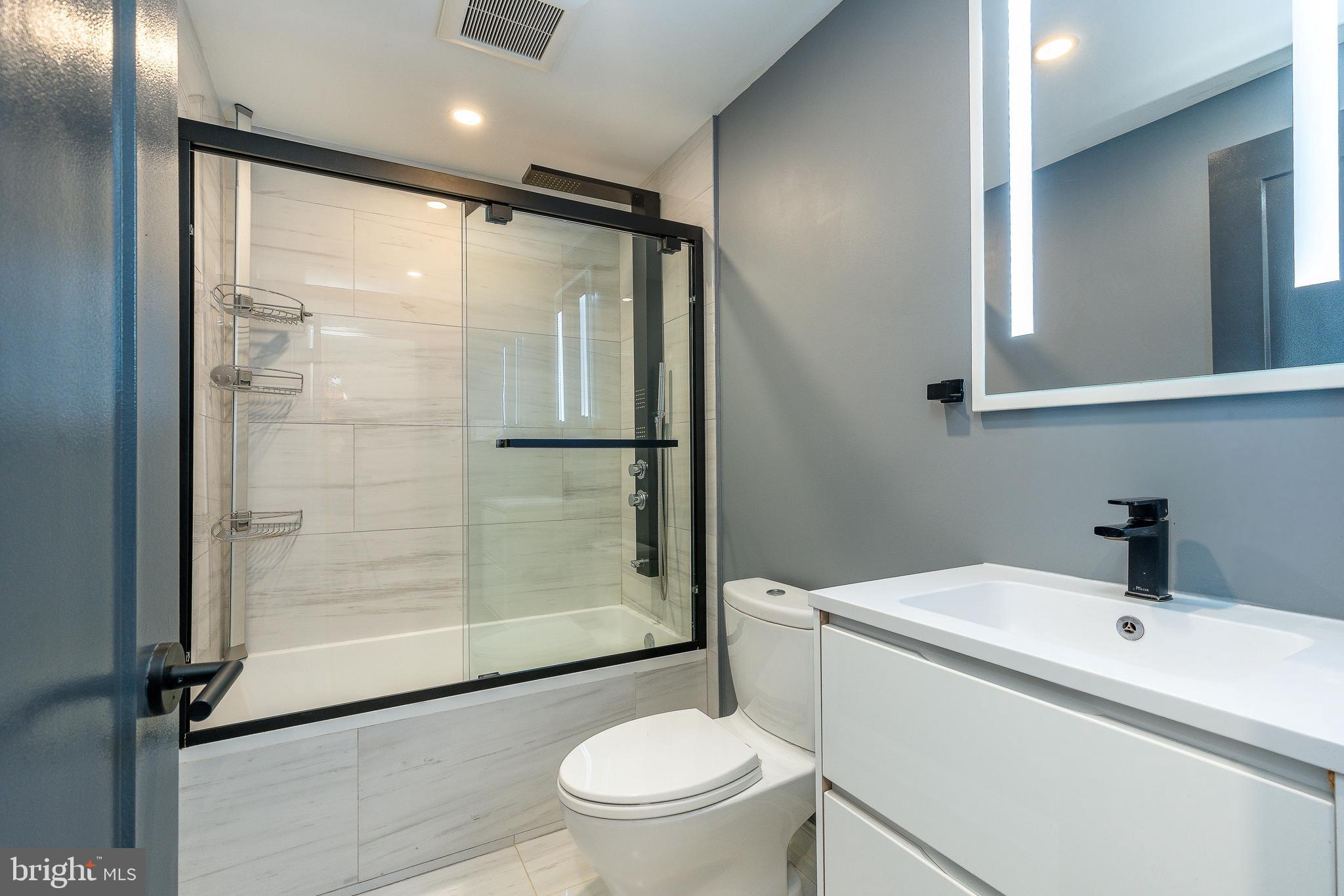 908 Spruce Street, Unit 10 Philadelphia, PA 19107 - Photo 12 of 41 a bathroom with a shower a toilet and sink