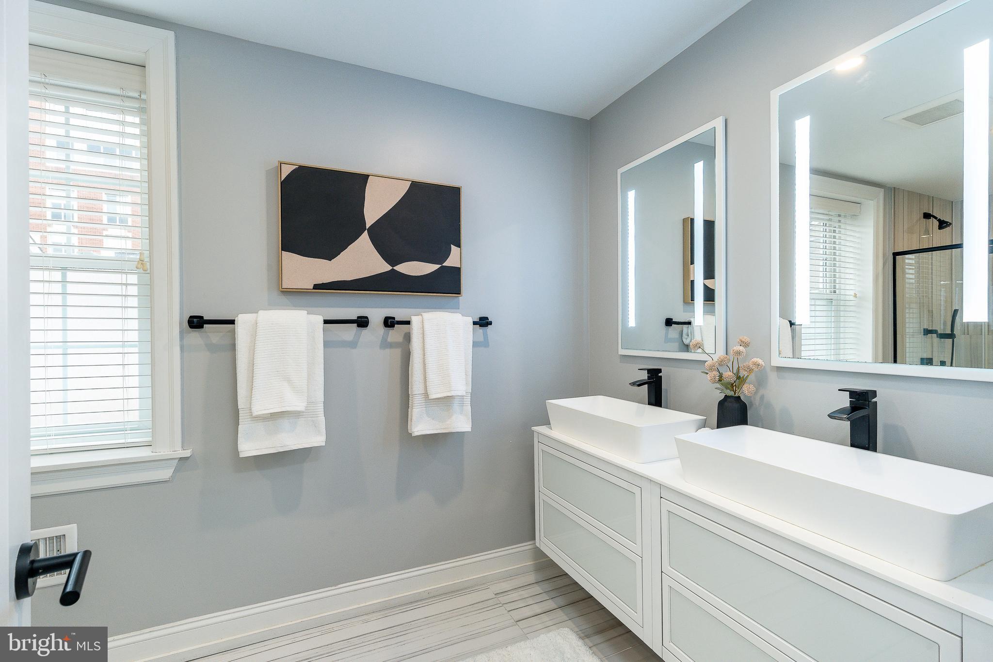 908 Spruce Street, Unit 10 Philadelphia, PA 19107 - Photo 24 of 41 a bathroom with a sink and a mirror