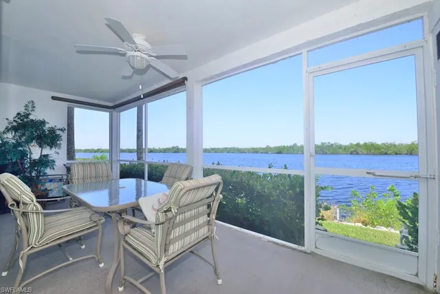 a living room with large windows
