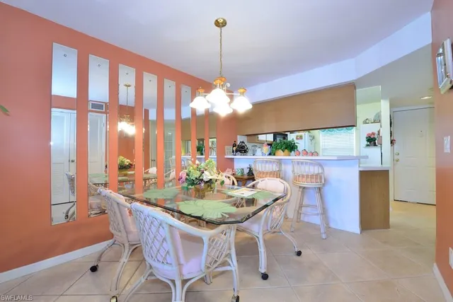 a dining room filled with furniture and window