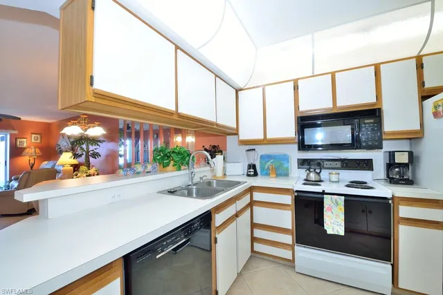 a kitchen with stainless steel appliances a stove and a microwave