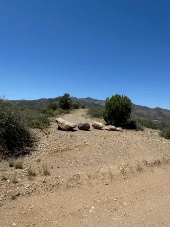a view of ocean beach and mountain