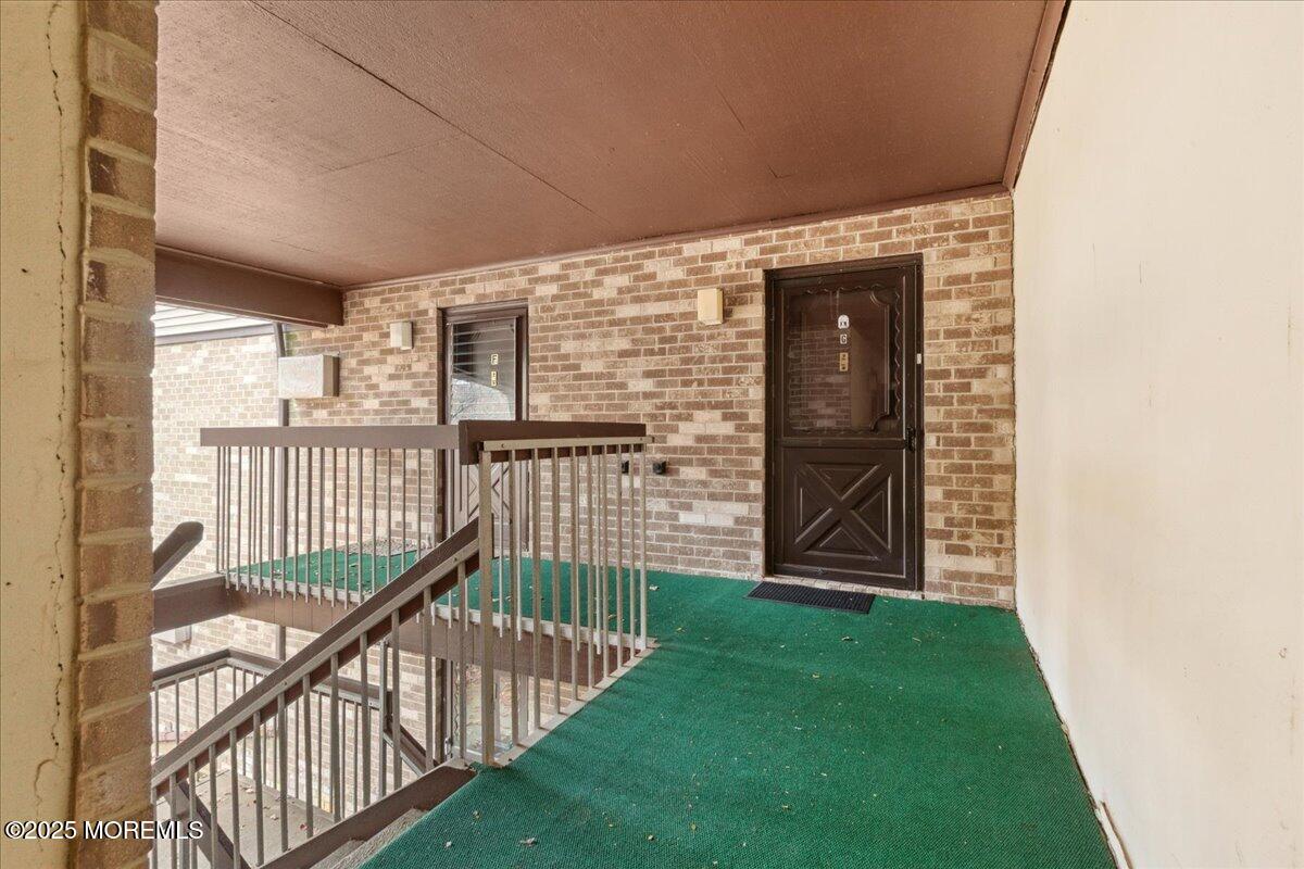 93 Arrowood Road, Unit G Manalapan, NJ 07726 - Photo 4 of 16 a view of a porch
