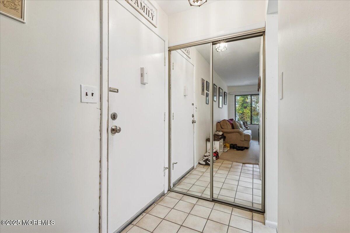 93 Arrowood Road, Unit G Manalapan, NJ 07726 - Photo 5 of 16 a room with a glass door and shower