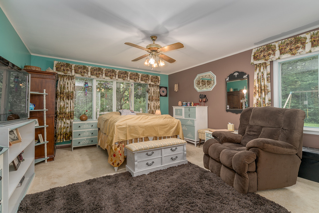 3030 North Jugtown Road Morris, IL 60450 - Photo 12 of 35 a bedroom with a bed couch and a large window