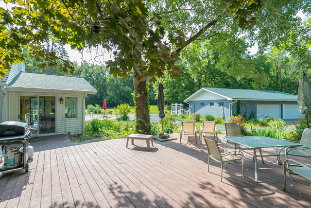 3030 North Jugtown Road Morris, IL 60450 - Photo 28 of 35 a patio table and chairs under an umbrella
