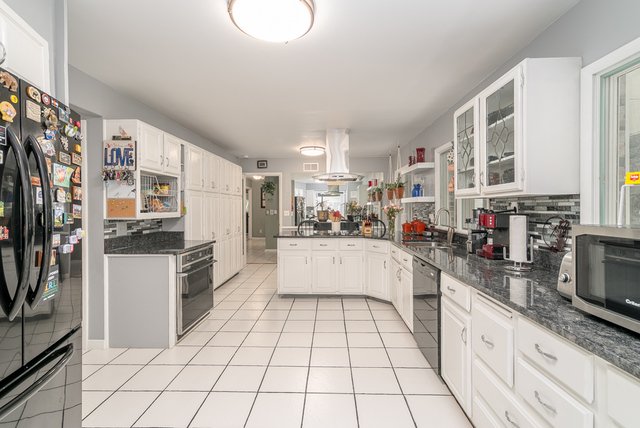 3030 North Jugtown Road Morris, IL 60450 - Photo 5 of 35 a large white kitchen with a stove a sink dishwasher and a refrigerator