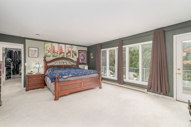 3030 North Jugtown Road Morris, IL 60450 - Photo 8 of 35 a bedroom with a large bed and a large window