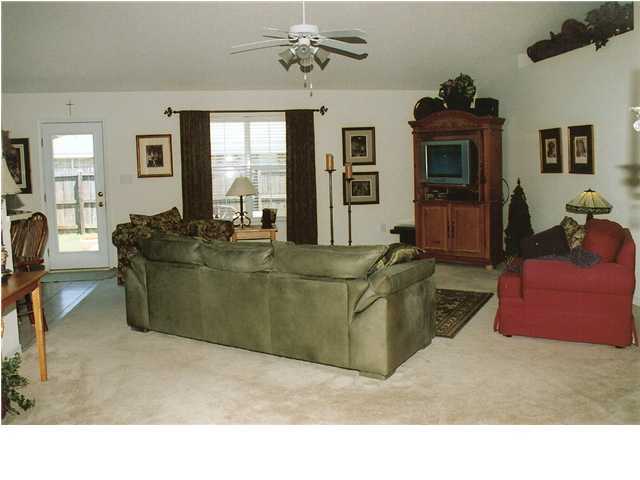 185 Beacon Way Miramar Beach, FL 32550 - Photo 3 of 14 a living room with furniture and a flat screen tv